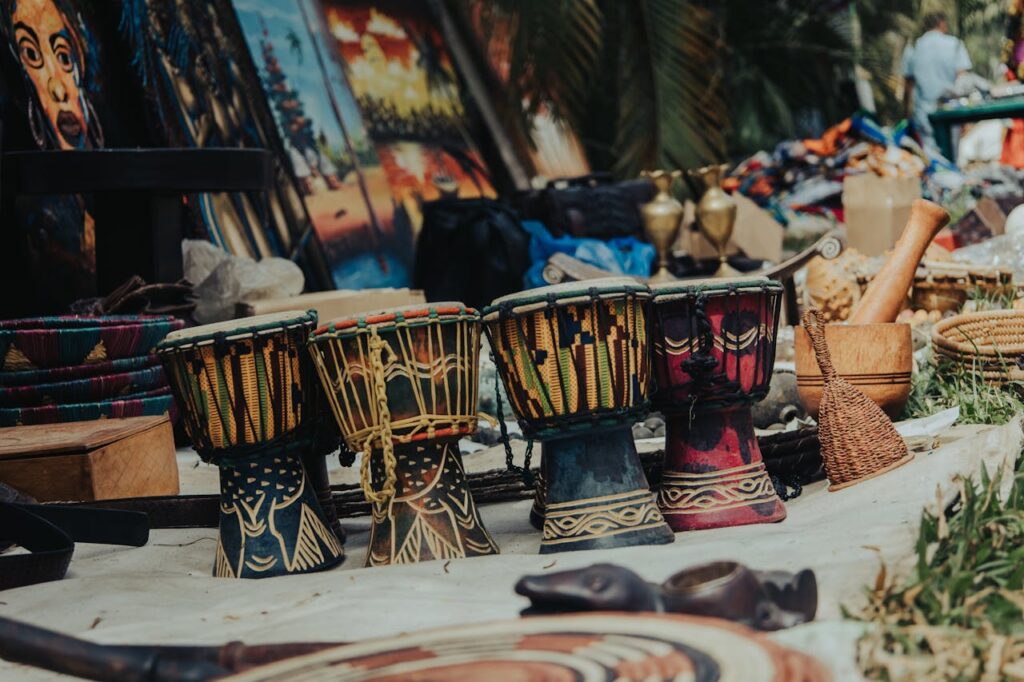 pexels-photo-20164410 Vibrant traditional drums and crafts at an outdoor market in Abuja, Nigeria.