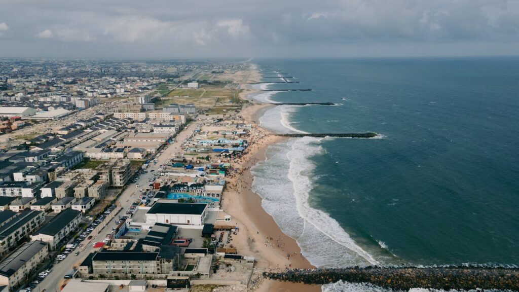 pexels-photo-27857461 A stunning aerial view of Lagos, Nigeria, featuring the coastline and bustling cityscape along the Atlantic Ocean.