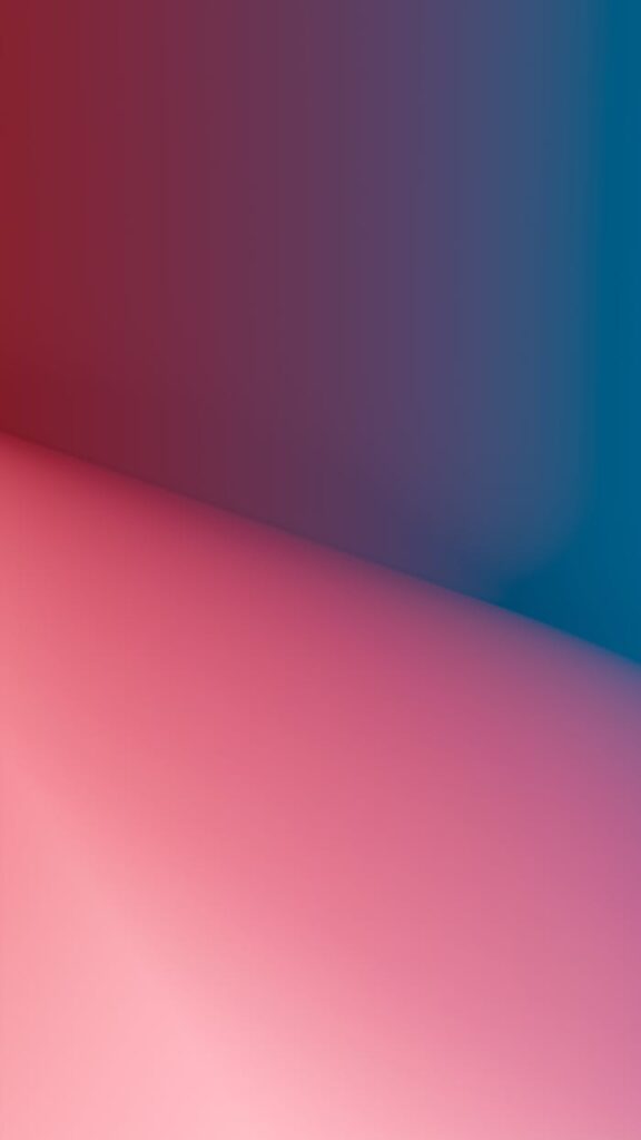 pexels-photo-29450011 Vibrant geometric abstract background with pink to blue gradient.